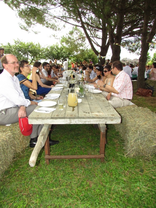 Dining on bales of hay and eating off the old wagons once used to move them. Genius!